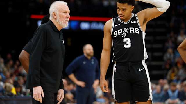 Jan 2, 2024; Memphis, Tennessee, USA; San Antonio Spurs head coach Gregg Popovich (left) talks with forward Keldon Johnson (3) during the second half against the Memphis Grizzlies at FedEx Forum.